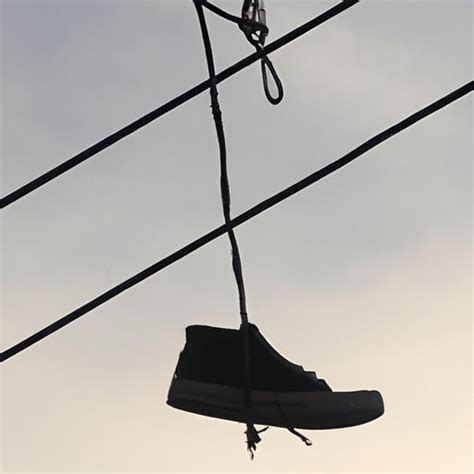 sneakers on telephone wire meaning.